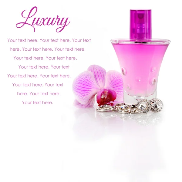 Diamond earrings, perfume and orchid flower — Stock Photo, Image