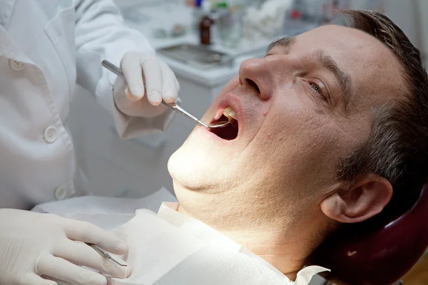 Man at the dentist office — Stock Photo, Image