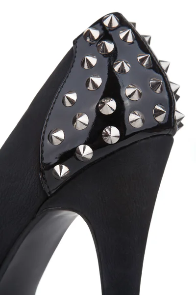 Detail van een zwarte stiletto schoen met drukknopen — Stockfoto