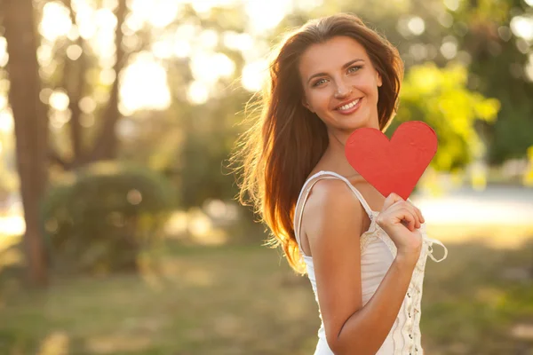 Woman with red heart Stock Photo
