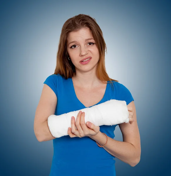 Woman with broken hand Stock Picture