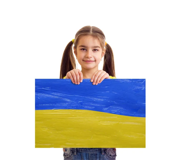 Girl holding Ukrainian blue and yellow flag — Photo