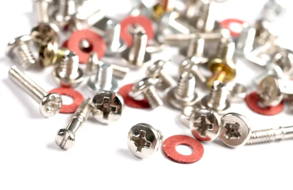 Screws, bolts and nuts on a white background — Stock Photo, Image