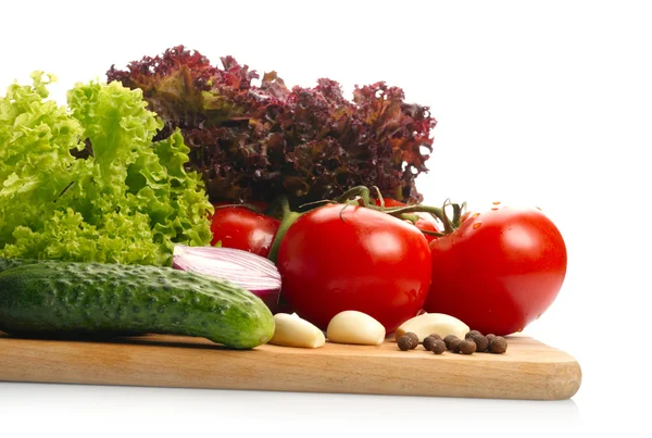 Fresh vegetables on wooden hardboard — Stock Photo, Image