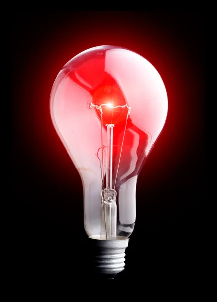 Photo of light bulb on black background — Stock Photo, Image