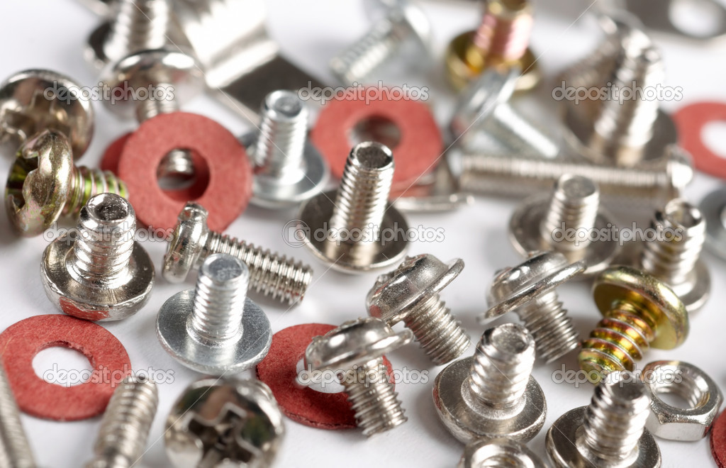 Screws, bolts and nuts on a white background