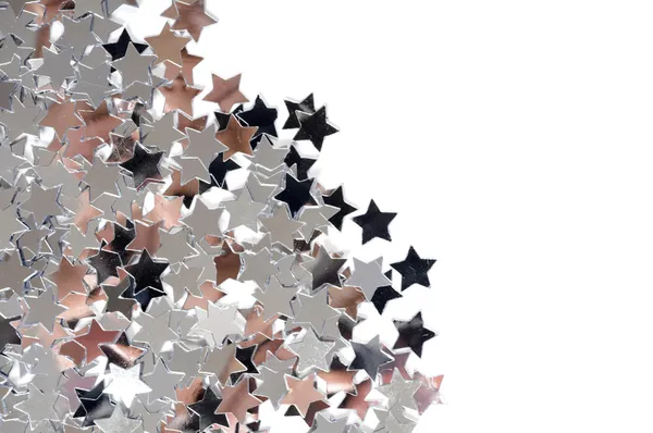 Серебряные звёзды на белом фоне — стоковое фото