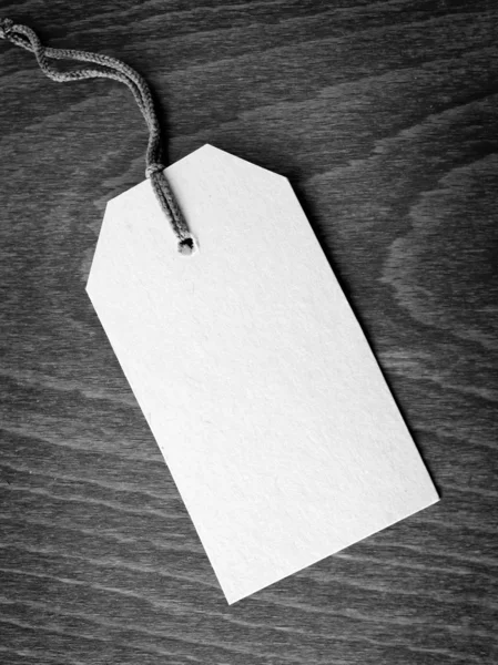 Blank tag on wooden background — Stock Photo, Image