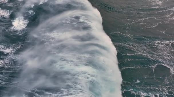 Huge wave crashing in open water of Atlantic ocean. High Quality Aerial slow motion shot of sea or ocean surf with white foam — стоковое видео