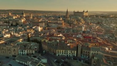Flying around Toledo, Spain at sunset. Aerial shot of street, houses and cathedrals in Toledo. High quality, 4K.
