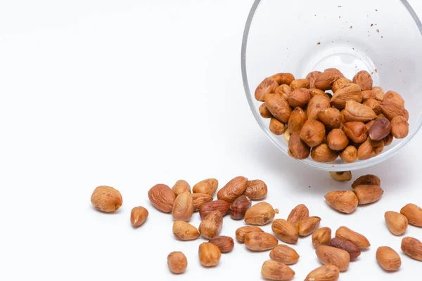 Hazelnuts Falling Out Glass Bowl Isolated White Background Vegan Healthy — Stock Photo, Image