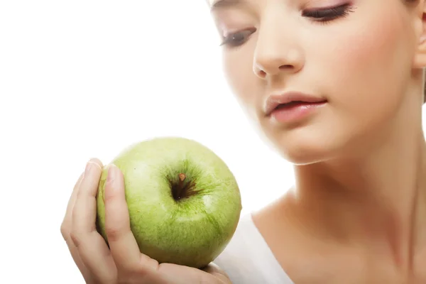 Cabeza de mujer sosteniendo manzana — Foto de Stock