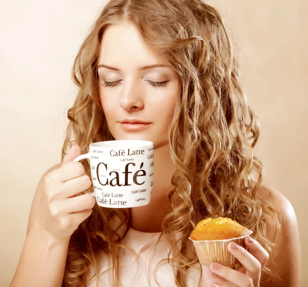 Woman with coffee and cake