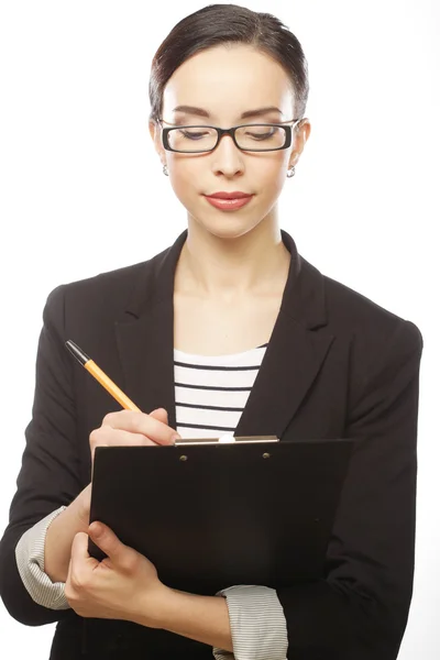 Woman with glasses holding clipboard Stock Photo