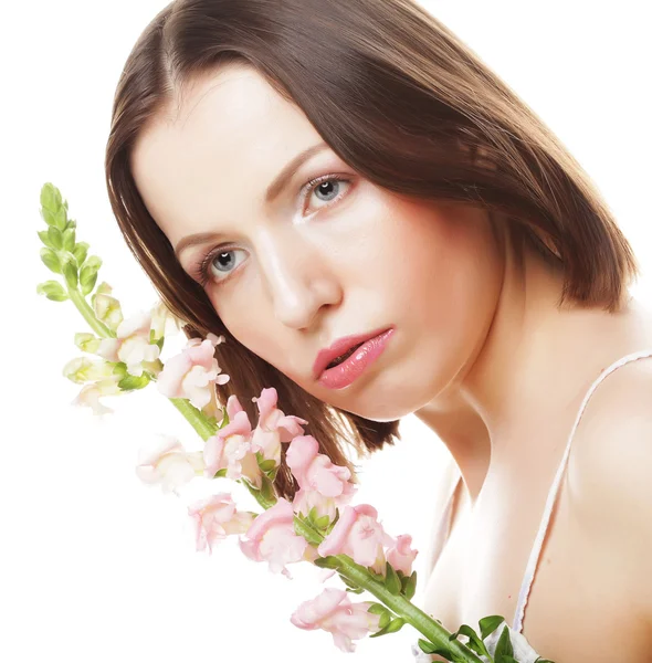 Mulher com flores rosa — Fotografia de Stock