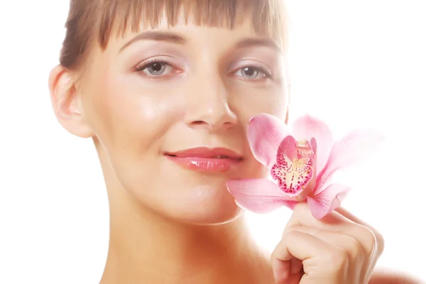 Young beautiful woman with pink flower Royalty Free Stock Images