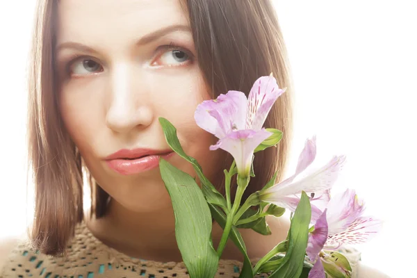 Woman with pink flowers Stock Photo