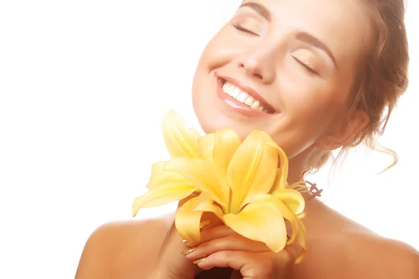 Young girl with yellow lily laughs — Stock Photo, Image