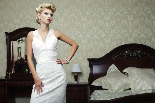 Happy bride posing in hotel room — Stock Photo, Image