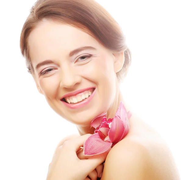 Mujer con orquídea rosa — Foto de Stock