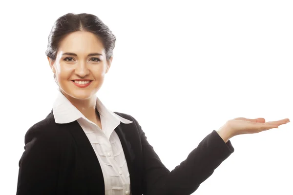 Happy smiling young beautiful business woman showing blank area — 图库照片