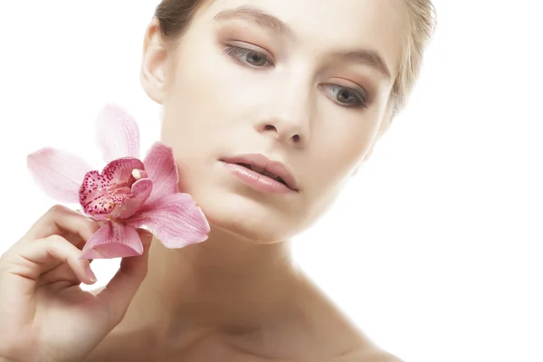 Woman with pink orchid — Stock Photo, Image