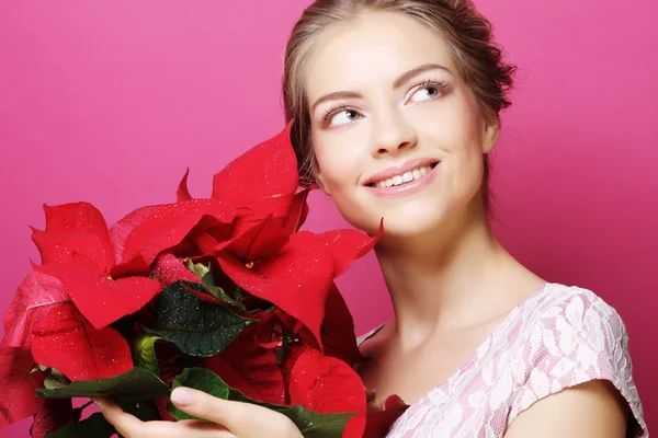 Frau mit Weihnachtsstern — Stockfoto