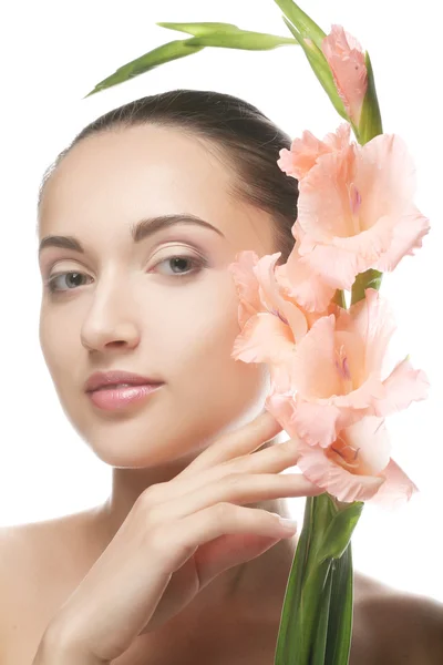 Woman with gladiolus flowers in her hands — Stock Photo, Image