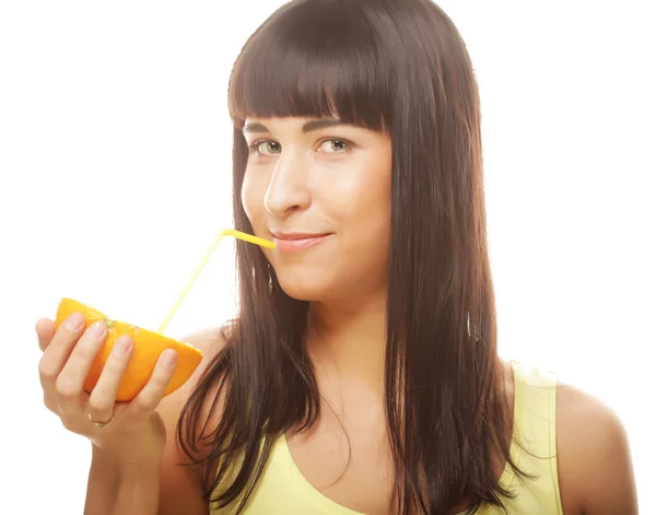 Beautiful woman drinking juice with straw — Stock Photo, Image