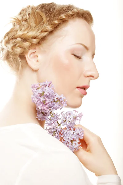 Spring girl with lilac flowers. — Stock Photo, Image