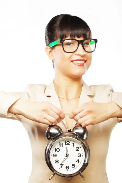 Businesswoman wearing glasses holding alarm clock — Stock Photo, Image