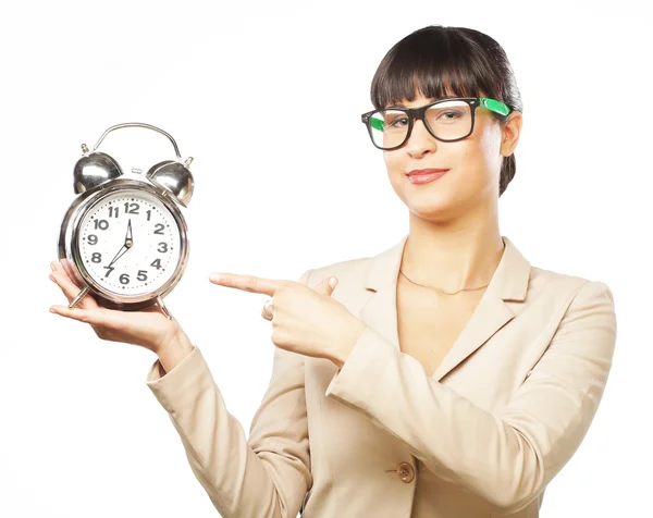 Businesswoman wearing glasses holding alarm clock — Stock Photo, Image