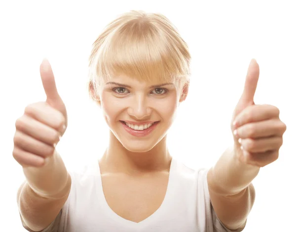 Casual girl showing thumbs up and smiling — Stock Photo, Image