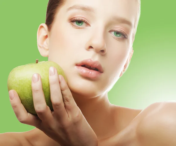 Head shot of woman holding apple — Stock Photo, Image