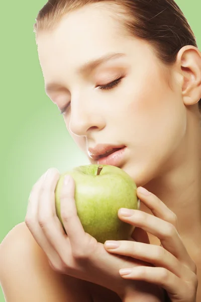 Head shot of woman holding apple — Stock Photo, Image