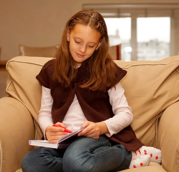 Cute little girl painting at home — Stock Photo, Image