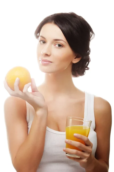 Woman holding orange and juice — Stock Photo, Image