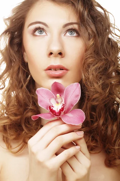 Beautiful woman with pink orchid — Stock Photo, Image