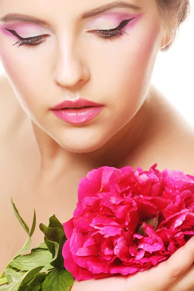 Woman with pink flower Stock Photo