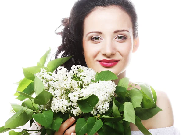 Kobieta z białymi kwiatami — Zdjęcie stockowe