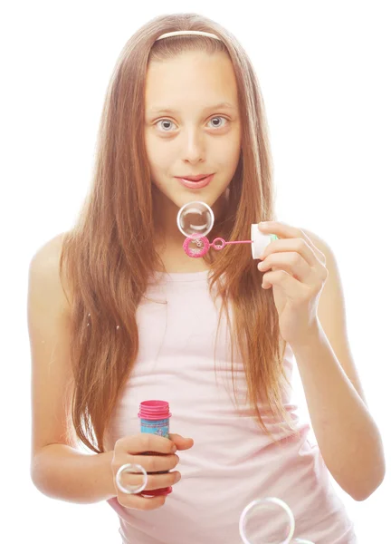 Funny lovely little girl blowing soap bubbles — Stock Photo, Image
