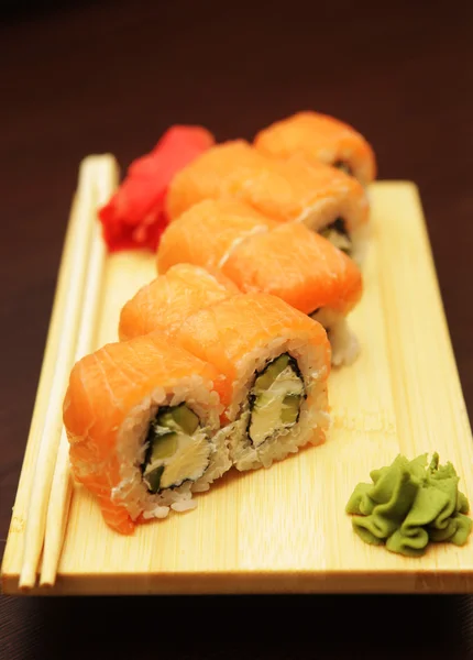 Japanese sushi served on wooden board — Stock Photo, Image