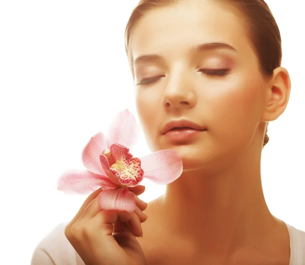 Young woman with pink orchid — Stock Photo, Image