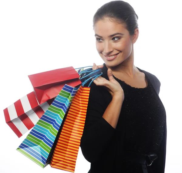 Mujer joven llevando bolsas de compras — Foto de Stock