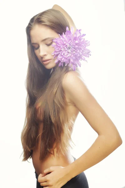 Woman with long hair holding big flower — Stock Photo, Image