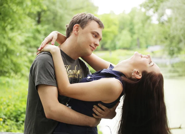 Happy young guy with girlfriend — Stock Photo, Image