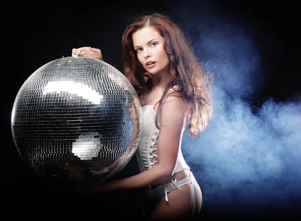 Dancer girl in smoke with disco ball — Stock Photo, Image