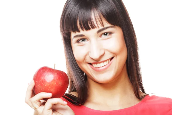 Ung flicka med ett rött äpple i handen — Stockfoto