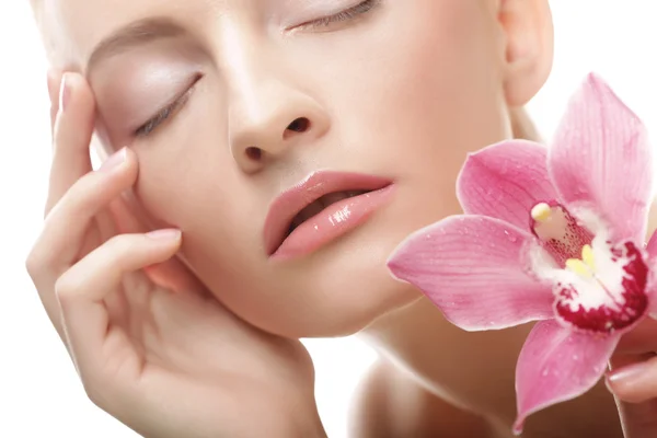 Young beautiful woman with pink flower — Stock Photo, Image