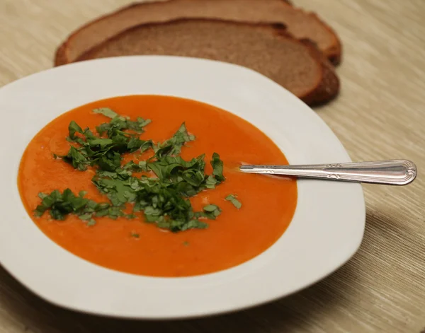 Closeup of a bowl with pumpkin soup — Stock Photo, Image